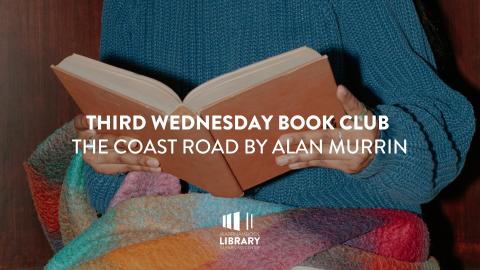 Close up of hands holding an open book 